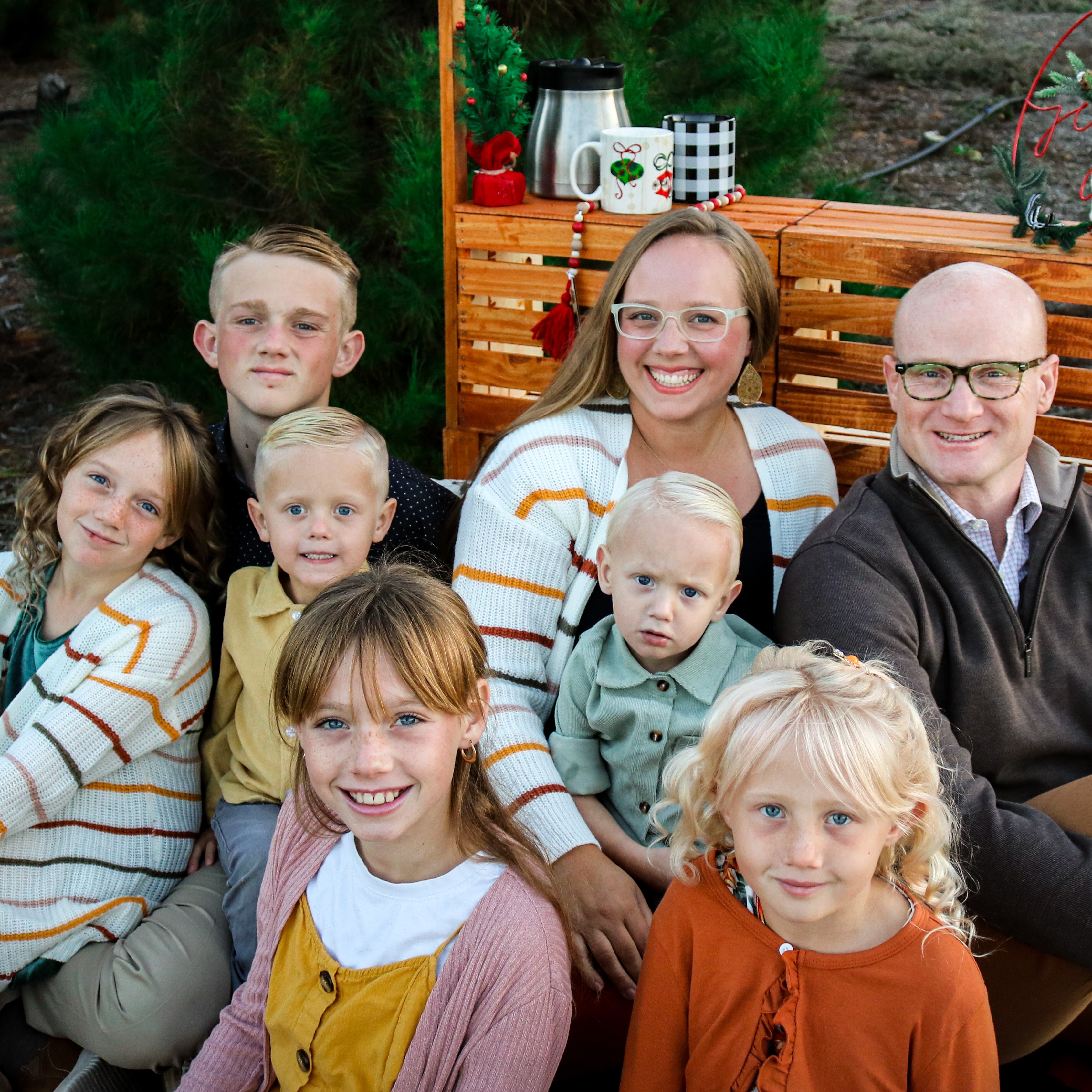 A photo of a family with Alison Downs, her husband, and her children..